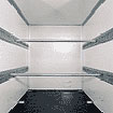 Box trailer interior with integrated tie-down rails for flexible cargo securing
